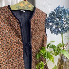 Vintage brown printed quilted vest with pockets, ties fasteners. Label: ** check the actual measurements: bust 40" 102 cm waist 40" 102 cm length 24" 61 cm Condition: very good. Clothing is measured on a flat surface. Please compare the actual measurements with a similar item of your clothing that fits you, and don't forget to leave room for body movement! Please take the time to read the store policy. After making a purchase, it will be considered that you have read the rules and agreed to them Quilted Gilet, Vest With Pockets, Body Movement, Quilted Vest, Vest Outfits, Flat Surface, Vintage Brown, The Rules, Favorite Outfit