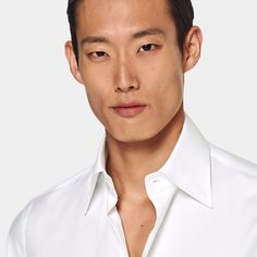 This crisp white button-up is tailored to a tailored fit and features a large point collar and single cuff-a classic style that's perfect for any formal look. Modern White Shirt With Lapel Collar, Elegant Single Breasted Business Shirt, Elegant Single-breasted Business Shirt, Elegant Single-breasted Shirt For Business, Elegant Single-breasted Formal Tops, White Shirt With Button Cuffs And Lapel Collar, White Shirt With Hidden Button Closure And Spread Collar, Timeless White Shirt With Button Closure, Elegant White Shirt With Hidden Button Closure