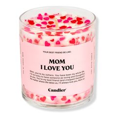 a candle with pink and red hearts in it that says, mom i love you