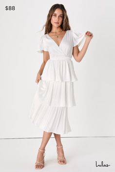 Your heart will be racing from how quickly you'll fall in love with the luxe look of the Lulus Twirl-wind Romance White Satin Tiered Midi Dress! Sleek woven satin shapes this lovely dress that features a lightly gathered bodice and a surplice neckline, framed by fluttery short sleeves. Back button closure secures atop a keyhole cutout. An elasticized, banded waist tops a flouncy, tiered midi skirt with pleated detailing throughout. Fit: This garment fits true to size. Length: Mid-calf length. Si Modest White Dress, Midi Dress Satin, White Tiered Dress, Gathered Bodice, Tier Dress, Tiered Midi Skirt, Surplice Neckline, Tiered Midi Dress, Dress Satin