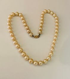 This off white individually tied 8mm pearls is 18 inches long. The beads are a nice quality with a gold plated flower pearl clasp. The beads are hand knotted between each bead. The necklace is super strong and does show some signs of previous wear so it has a broken in feel but no damage. I specialize in finding fun wearable jewelry. Please browse my shop for more options. I box jewelry sales in new gift boxes. I have lots of faux pearls in the necklace section of my shop. I often combine multip Pearl Clasp, Wire Cuff, Faux Pearl Necklace, Bright Gold, Copper Bracelet, Flower Plates, Gold Pearl, White Vintage, Jewelry Sales