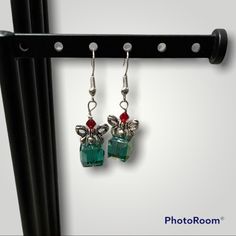 Nwt - Swarovski Crystal Christmas Present Earrings--Handmade Earrings Composed Of 1 Green Square Swarovski Crystal Bead, 1 Round Silver Bead, 1 Silver Bow Bead, & 1 Red Crystal Bead. The Ear Wires Are Silver Plated. The Earrings Are Perfect For Wearing To All Of Your Holiday, Christmas, New Year's Events And Would Make A Great Gift, Holiday Gift, Christmas Gift, Or Stocking Stuffer. Width At Widest Point: 1.25 Cm Length: 3.75 Cm Ships Out The Same Or The Next Business Day. Offers Will Be Conside Christmas Gift Dangle Crystal Earrings, Christmas Gift Crystal Dangle Earrings, Elegant Beaded Earrings For Christmas Gift, Elegant Beaded Earrings As Christmas Gift, Present Earrings, Candy Corn Earrings, Gold Bead Earrings, Peach Earrings, Carnelian Earrings