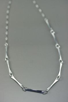 Minimalist chain, link bar chain, modern minimalist, handcrafted sterling silver chain, women chain, artisan jewelry, everyday necklace This modern style chain is made with sterling silver ; its line are subtle and clean, original yet simple at the same time. A unique design, drawn and made by the artist for people who like simple and clean jewelry.  A ideal present  for birthday(anniversary), Mother's Days, wedding, Christmas or to offer itself to oneself! matching earring : https://www.etsy.com/ca/listing/220008855/silver-modern-women-earring-minimalist?ref=shop_home_active_8 matching bracelet : https://www.etsy.com/ca/listing/203645720/delicate-bracelet-silver-women-bracelet?ref=shop_home_active_13 retour à ma boutique : https://www.etsy.com/ca/shop/stephanielemelin?ref=listing-shop2-al Minimalist Sterling Silver Chain Necklace, Minimalist Sterling Silver Chain Necklace With Rectangular Links, Modern Sterling Silver Chain Necklace For Everyday, Modern Sterling Silver Chain Necklace With Rectangular Links, Minimalist Sterling Silver Necklace With Rectangular Links, Silver Chain Women, Minimalist Chain, Creative Necklace, Mens Silver Jewelry