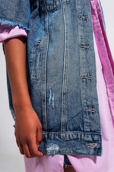 Express your sense of style in using this short-sleeved, longline distressed denim jacket as a layering piece. With an urban vibe, this oversized jacket boasts of a wide-collar neckline, a boyfriend fit, seam details, chest pockets, a button placket, frayed ends, and fabric made from rigid non-stretch 100% Cotton denim. In our photos, we layer this jacket over our Cotton Oversized Shirt in Pink. The model is 5’8” with measurements of 32-24-38 and is wearing a size small. The XS-S-M-L-XL sizing e Boyfriend Jean Jacket, Light Blue Jean Jacket, Urban Jeans, Boyfriend Denim Jacket, Lightweight Denim Jacket, Light Wash Denim Jacket, Oversized Jean Jacket, Types Of Jeans, Blue Jean Jacket