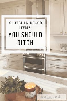 a kitchen with white cabinets and a wooden cutting board on the counter top that says 5 kitchen decor items you should ditch