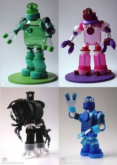 four different types of toy robots in various colors and sizes, with one robot standing on the