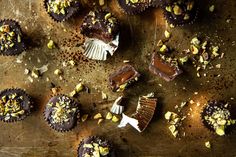 chocolates and nuts are scattered around on a table