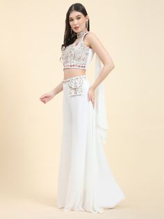 Take your ethnic wear game to the next level with our sweet white mirror work georgette event wear crop top palazzo set. This stunning ensemble includes a white color georgette crop top adorned with heavy mirror work and embroidered details, a coordinating palazzo with similar embroidery work, and a georgette dupatta to complete the look. Perfect for festivals, functions, and events, this outfit is the epitome of elegance and style.
The crop top and palazzo set are fully stitched and available i Georgette Crop Top, Crop Top Palazzo, Reception Suits, Lehenga Crop Top, Lehenga Choli Wedding, Floral Lehenga, Party Wear Lehenga Choli, Reception Gown, Georgette Dupatta