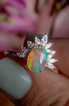 Stunning Opal  😍 This sterling silver ring is the perfect anniversary gift! Metal : 925 Sterling Silver (engraved) Main stone: Opal oval cut 6*8 mm Accent stones: Highest Quality Cubic Zirconia (5A) Sizes 6,7,8,9 ✔️Hypoallergenic - won't tarnish at all ✔️Lightweight ✔️Free microfiber bag ✔️Free US Shipping If you'd like to include a personalized message just send it to me when checking out. A piece of jewelry can be damaged when performing daily activities such as cleaning, washing dishes, etc. Make sure to remove your rings beforehand and store it in a safe place. This will help prevent any damage and preserve the piece. Exposing jewelry to household liquids, perfumes, extreme temperatures and cosmetics can cause gold plating to discolor. It would be best to keep your piece in the microf Engagement Roses, Opal Statement Ring, October Birthstone Rings, Nature Ring, Opal Engagement, Engagement Rings Opal, 14k Rose Gold Ring, Washing Dishes, October Birthstone