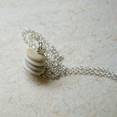 "Four stacked and drilled beach stones in shades of tan, sand and beige hang from a sterling silver rolo chain to form this minimalist, simple stone Cairn necklace. The necklace closes with a spring ring clasp. All metal in this necklace is sterling silver. The pendant is approximately 1\" long, including jump ring. Choose length at checkout: 18\". 20\". 22\". 24\". This is my stock photo for this necklace. If you want to see the exact Cairn that you will get contact me BEFORE placing your order Cairn Necklace, Stone Cairns, Beautiful Beach Wedding, Beach Stones, Rolo Chain, Jump Rings, Spring Rings, Diamond Earrings, Handmade Jewelry