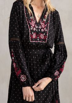 A versatile bohemian mid-length dress featuring voluminous lantern sleeves, floral embroidered bib & sleeves, and a feminine ruffled hem skirt. Dress it up with a pair of strappy heels or pair it with tall vintage cowboy boots for a festival-ready look! FINAL SALE Relaxed fit Long volume sleeve Mid-length Ruffle hem skirt Lattice trim Waist-defining tassel tie detail Model is 5'9, wearing a size S.Style: I-71654W-QSQ Bohemian Flowy Dress With Blouson Sleeves, Bohemian Long Sleeve Midi Dress With Smocked Cuffs, Spring Dress With Embroidered Bishop Sleeves, Flowy Bohemian Dress With Lantern Sleeves, Bohemian Midi Dress With Smocked Cuffs, Bohemian Long Sleeve Dress With Smocked Cuffs, Bohemian Maxi Dress With Bishop Sleeves For Spring, Elegant Lantern Sleeve Dress With Floral Embroidery, Bohemian Floral Print Dress With Bishop Sleeves