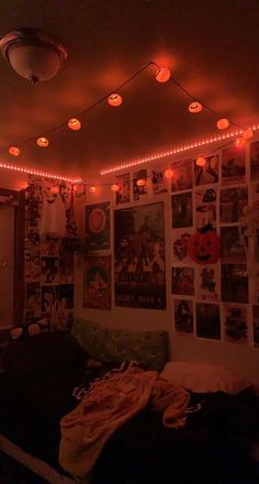 a bedroom with lights and pictures on the wall