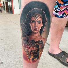 a woman's leg with a tattoo on it that has a portrait of wonder