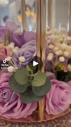 a vase filled with flowers on top of a table