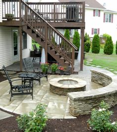 an outdoor patio with stairs and seating area