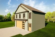 a two story garage with the front door open on a grassy area next to trees