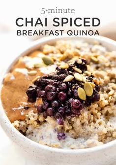 a bowl filled with oatmeal topped with blueberries and nuts in front of the words 5 - minute chai spiced breakfast quinoa