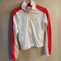 Nike Zip Up Jacket With Jersey Like Material And Zipper Pockets. Never Worn Only Hand Washed, Line Dried. From A Smoke Free Home. White Stretch Sporty Track Jacket, White Stretch Casual Track Jacket, Casual White Stretch Track Jacket, White Long Sleeve Track Jacket For Spring, Nike Long Sleeve Track Jacket For Spring, Nike Spring Long Sleeve Track Jacket, White Stretch Track Jacket, Sporty Stretch Red Outerwear, Red Stretch Sporty Outerwear