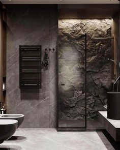 a modern bathroom with stone walls and flooring