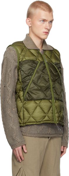 Lightweight down-filled and quilted nylon micro-ripstop vest. Elasticized trim throughout. · Y-neck · Pull-tabs at two-way zip closure · Reinforced panel at zip pockets · Reflective logo printed at front · Bungee-style drawstring at hem · Patch pockets at interior · Fully lined Supplier color: Olive branch Fill: 90% white duck down, 10% white duck feather. Nylon Vest With Zipper Closure For Streetwear, Functional Nylon Vest With Zipper Closure, Outdoor Nylon Vest With Zipper Closure, Quilted Nylon Functional Vest, Functional Quilted Nylon Vest, Outdoor Quilted Down Vest, Light Down, Duck Feather, White Duck