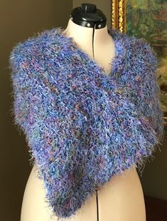 "Hand Knit, gently pre-worn, wrap around shawl. Feathery feel. Like new.  Machine washed delicate cycle. Lay flat to dry.  Drape over the shoulder loosely or close with a brooch or shawl pin. Dimensions: 11\" x 39\" Lightweight. Made in the 90's, pre-2000." Hand Knitted Blue Shawl For Winter, Blue Hand Knitted Winter Shawl, Hand Knitted Blue Winter Shawl, Blue Hand Knitted Scarf, Blue Crochet Shawl One Size, Hand Knitted Blue Shawl One Size, Blue Crochet Yarn Shawl, Purple Scarf, Shawl Pin