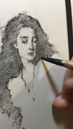 a pencil drawing of a woman's face with her eyes closed and hands holding a pencil