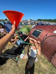 a group of people standing around a tent