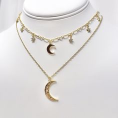 "This listing is for one gold plated moon and star cubic zirconia charm choker necklace with a resizable/adjustable gold plated chain. This necklace is 14\" long with a 3.5\" extension, maximum length of the necklace is 17.5\" long. Perfect piece on its own or great for layering! Complementary moon necklace is available for sale in another listing on my page." Adjustable Dangle Jewelry With Star Charm, Adjustable Dangle Star Charm Jewelry, Adjustable Moon Clavicle Chain Jewelry, Adjustable Moon Shaped Clavicle Chain Jewelry, Adjustable Moon-shaped Clavicle Chain Jewelry, Adjustable Celestial Necklace With Star Charm, Gold Cubic Zirconia Necklace With Star Charm, Adjustable Celestial Clavicle Chain Jewelry, Adjustable Celestial Clavicle Chain Necklace