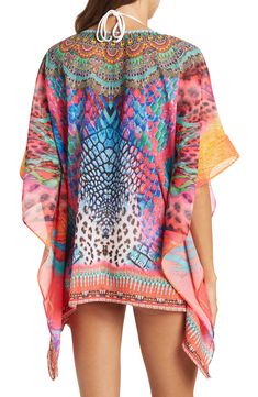 Unleash your free boho spirit in this poncho styled with vivid allover patterns and beaded embellishments. 28'' length (OS) V-neck Kimono sleeves All-over print Woven 100% polyester Dry clean Imported Model stats: 5'10", 32" bust, 25" waist, 36" hip. Model is wearing size OS. Multicolor Poncho For Beach Cover-up In Summer, Bohemian Multicolor Print V-neck Kaftan, Bohemian Multicolor Tunic Cover-up, Multicolor Printed Cover-up With Kimono Sleeves, Bohemian Multicolor Printed Cover-up, Casual Multicolor Boho Print Cover-up, Multicolor Boho Print Kaftan With Kimono Sleeves, Hippie Multicolor Poncho For Beach, Bohemian Multicolor Poncho For Festival