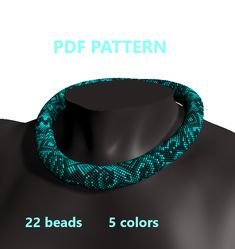 an image of a green snake skin necklace on a black mannequin necktie