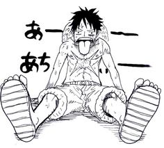 an anime character sitting on the ground with his feet crossed and one foot in front of him