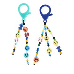 two colorful beaded keychais with different designs on them, one is blue and the other is green