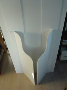 the corner of a white door is shown