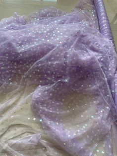 We offer a variety of fashion handmade fabric，those are widely use for wedding dress，garment and fashion cloth. we sell it by yard，our minimum order is 1 yards，and we always package it 15 yards for one roll，the width is 130cm/50 inch Material ： mesh ，Rayon,polyester. Symmetrical embroidery floral pattern, with lovely flowers in the middle, scalloped border. You can also cut and use separately. Perfect for dress, tops, wedding veil. You can split the piece up and have one scalloped edge around th Purple Tulle Fabric For Spring Wedding, Lavender Tulle Fabric For Wedding, Spring Wedding Purple Tulle Fabric, Purple Lace Tulle Fabric For Wedding, Purple Organza Tulle Fabric For Wedding, Purple Lace Tulle Fabric For Party, Spring Lace Patchwork Tulle Fabric, Spring Pink Tulle Fabric With Sequins, Purple Tulle Fabric For Party