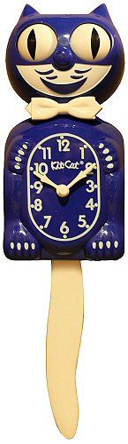 a blue and white clock with a cat face on it's face, sitting in front of a white background