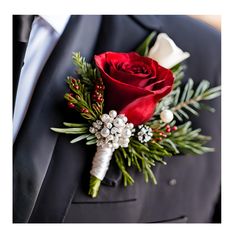 a red rose boutonniere on a man's suit lapel piece