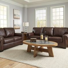 a living room with two couches and a coffee table