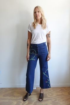 "WAS $132 now $95 Amazing 70s button fly sailor bells with embroidered vines and flowers through out. High rise, button fly, patch pockets, and belt loops. Measurements: fits like a medium Model wears a modern size 28 for reference waist:31\" hips:37\" rise:11.5\" inseam:27\" No label Great vintage condition" Big Sleeves Dress, Embroidered Vines, Military Suit, Big Sleeves, Sailor Pants, Suspender Pants, Chiffon Wrap, American Denim, 1980s Dresses