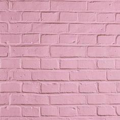 a pink brick wall that has been painted