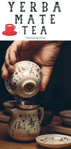 a person pouring tea into a cup on top of a wooden table with the words, year of the tea