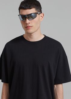 Color: Black Midweight t-shirt Boxy fit Crew neckline Drop shoulders Straight hem Unlined 100% Cotton Machine Wash Cold By The Frankie Shop. Imported Modern Boxy Fit Tops For Streetwear, Black Boxy Fit Top For Summer, Black Relaxed Fit Modern Tops, Modern Black Relaxed Fit Tops, Black Modern Tops With Relaxed Fit, Modern Black Short Sleeve Tops, Casual Boxy Black Top, Urban Black Tops For Everyday, Urban Style Black Tops For Everyday