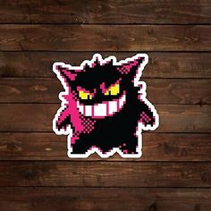 a sticker with an image of a cat on it's face and yellow eyes