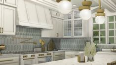 a kitchen with marble counter tops and gold accents on the cabinets, along with hanging lights