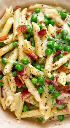 pasta with peas and bacon in a bowl