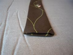 a close up of a tie on a bed