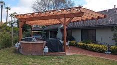 an outdoor hot tub and grill in the backyard