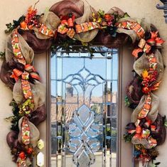 a door decorated with wreaths and ribbons