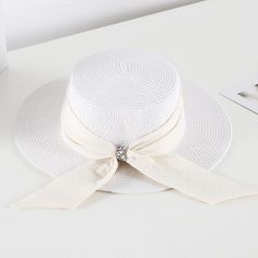 Product Category: Straw HatPopular elements: skirts, bows, tassels, irregular, plaid, squares, double rings, chains, asymmetryFor the season: SummerHat style: domeHat brim style: wide brimColor: khaki, black, pink, beige, pure white, ivory, redSize: M (56-58cm)Function: sun protection, neck protection, breathable, warm, windproof, sunshade, insect-proofSuitable for the crowd: adults, middle-aged, middle-aged, young, couples, students, women, menFabric name: StrawStyle classification: fresh and sweetStyle: adult straw hat, sun hat, sun hat, sun protection hat, beach hat Chic Brimmed Boater Hat With Bow, Chic Boater Hat With Bow For Vacation, Elegant Brimmed Sun Hat With Bow, Elegant Beach Hats With Bow, Chic Spring Hat With Bow, Elegant Beach Sun Hat With Bow, Elegant Fedora Sun Hat With Bow, Adjustable White Sun Hat For Picnic, Chic Boater Hat With Bow For Spring