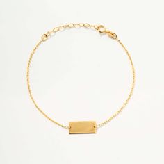 Discover the timeless elegance of the Engravable Bar Bracelet in 14K Solid Gold. This customizable piece, perfect as a name bracelet for women, is available in yellow, rose, or white gold. It's not just a bracelet, but a statement of style, allowing you to wear your initials or a significant name close to your heart. This 14k gold piece is the perfect blend of luxury and personalization, ensuring you stand out in any crowd. 14k solid gold handcrafted pieces 100% ethical sourced jewelry Material: Elegant 14k Yellow Gold Name Bracelet, Modern 14k Gold Nameplate Jewelry, Classic 14k Gold Personalized Chain Bracelet, Classic Personalized 14k Gold Chain Bracelet, Minimalist White Gold Plated Bracelets, Classic Adjustable 14k Gold Name Bracelet, Minimalist Rose Gold Bracelet With Polished Finish, Minimalist Polished Rose Gold Bracelet, Elegant 14k Gold Nameplate Chain Bracelet