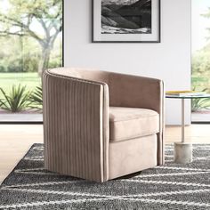 a chair sitting on top of a rug in a living room